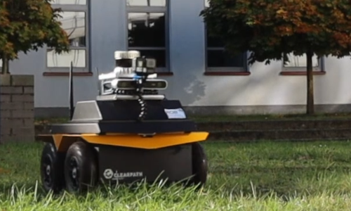 Robot driving through grass